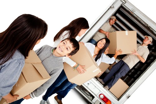 Furniture removals team handling apartment access in Canary Wharf