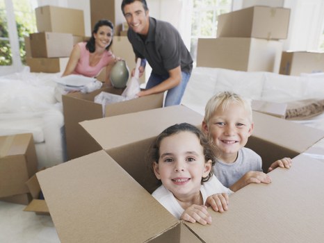 Removal company moving team in Canary Wharf with boxes and van