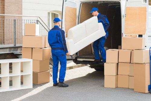 Moving boxes and belongings outside a Canary Wharf residential building