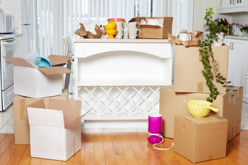 Trained movers handling furniture carefully during a Canary Wharf removal