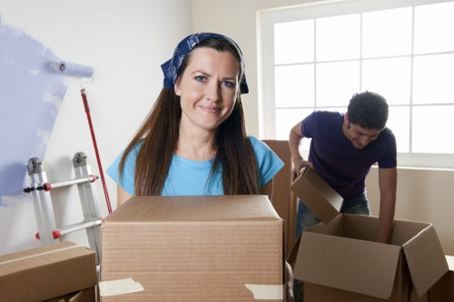 Professional movers handling a flat relocation in a Canary Wharf high-rise