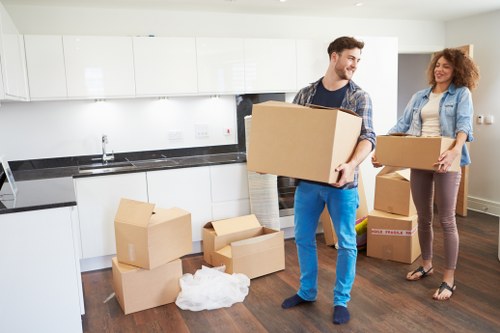 Packed moving boxes and furniture ready for transport