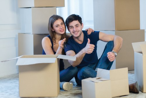 Movers handling household items for a Canary Wharf relocation