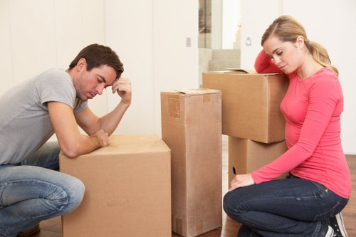 Local movers handling boxes and furniture for a Canary Wharf relocation