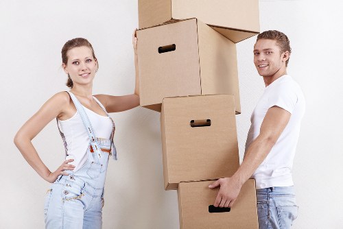 Removal team handling boxes and furniture during a Canary Wharf same day move