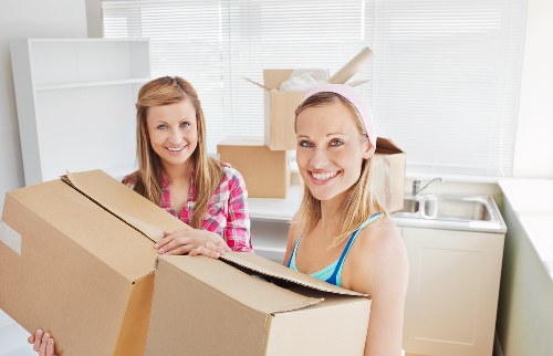 Organised student moving day in Canary Wharf with boxes and luggage